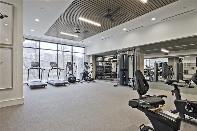 workout area featuring expansive windows, recessed lighting, and carpet flooring