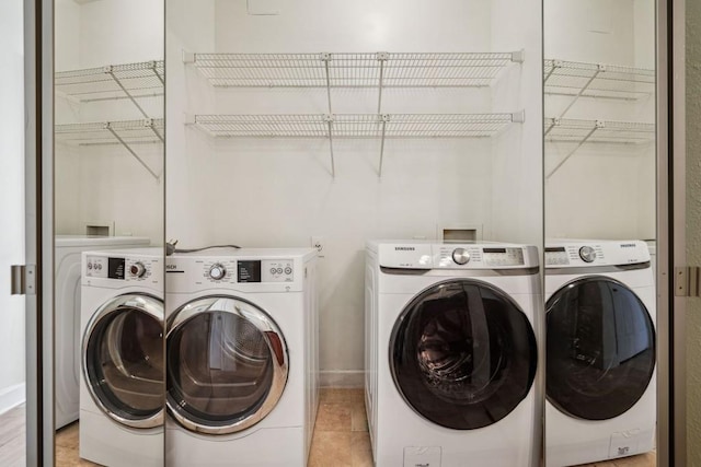 laundry room with washer and dryer and laundry area