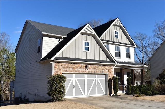 view of front facade with central AC, a porch, and a garage