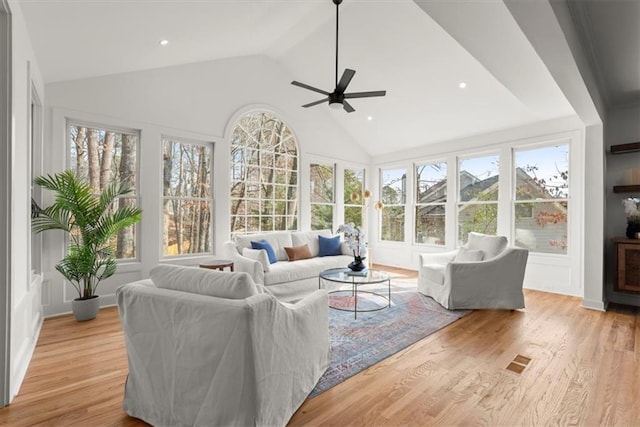 sunroom / solarium with vaulted ceiling and ceiling fan