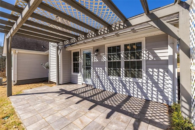 view of patio / terrace with cooling unit and a pergola