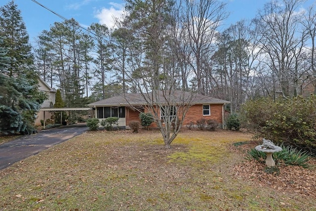 single story home featuring a carport