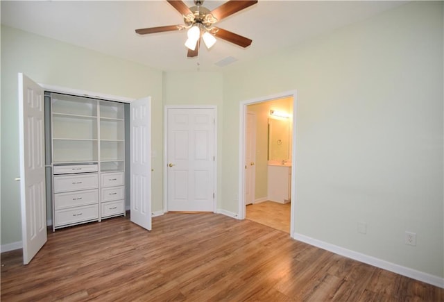 179 Camry Ln, Grayson, GA 30017 - unfurnished bedroom with wood finished floors, baseboards, and a closet