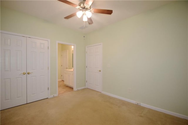 179 Camry Ln, Grayson, GA 30017 - unfurnished bedroom featuring light carpet, baseboards, a closet, ensuite bathroom, and ceiling fan