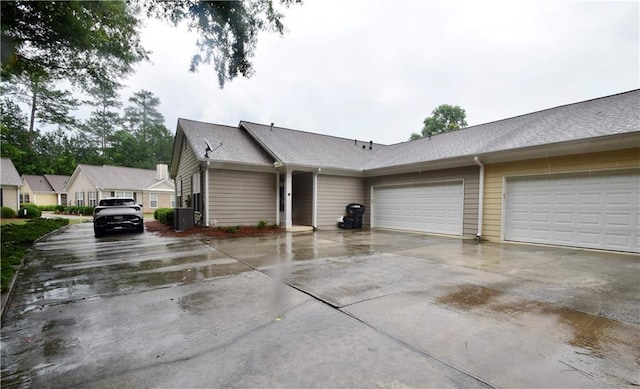 179 Camry Ln, Grayson, GA 30017 - view of home's exterior featuring driveway, a garage, and roof with shingles