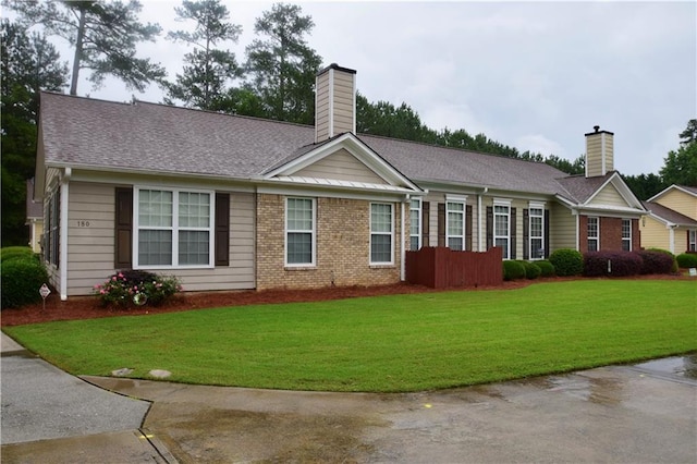 179 Camry Ln, Grayson, GA 30017 - single story home featuring a chimney, a front yard, and brick siding