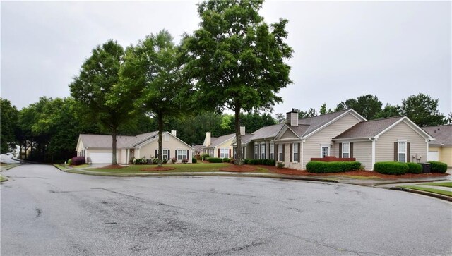 179 Camry Ln, Grayson, GA 30017 - view of asphalt street featuring sidewalks and curbs