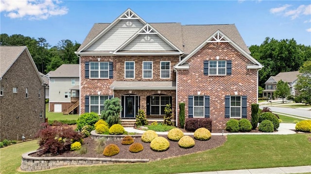 431 La Perla Dr, Sugar Hill, GA 30518 - craftsman-style home with brick siding and a front yard