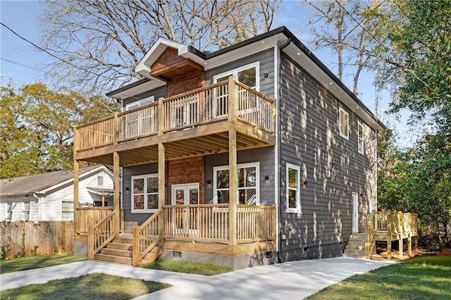 view of front facade with a wooden deck