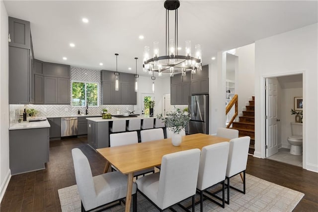 60 Newcastle St SW, Atlanta, GA 30314 - dining space featuring a chandelier, recessed lighting, dark wood finished floors, and stairway