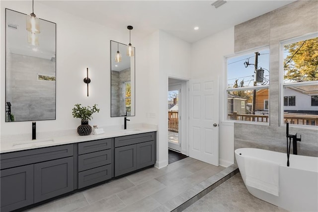 60 Newcastle St SW, Atlanta, GA 30314 - bathroom with double vanity and a soaking tub