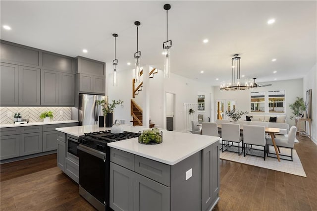 60 Newcastle St SW, Atlanta, GA 30314 - kitchen featuring gray cabinets, appliances with stainless steel finishes, backsplash, recessed lighting, and open floor plan