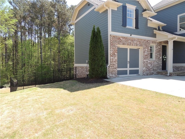 view of yard with driveway and a garage