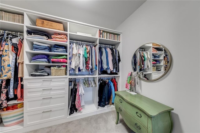 spacious closet with carpet floors and lofted ceiling