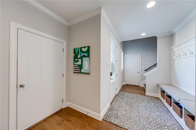 mudroom featuring wood finished floors, ornamental molding, baseboards, and recessed lighting