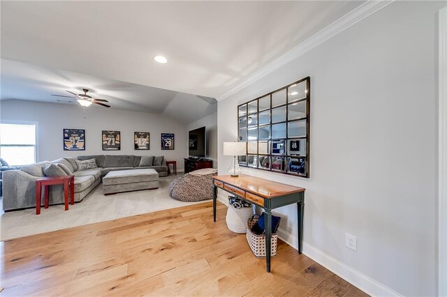 living room with ornamental molding, baseboards, a ceiling fan, wood finished floors, and recessed lighting