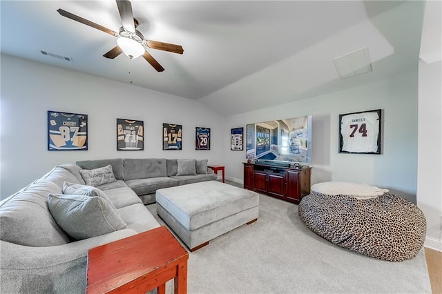 living area with light carpet, a ceiling fan, baseboards, and vaulted ceiling