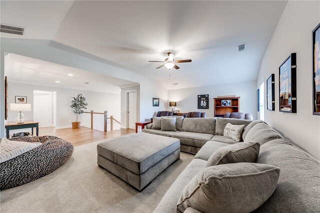 living room featuring a ceiling fan, light wood finished floors, and recessed lighting