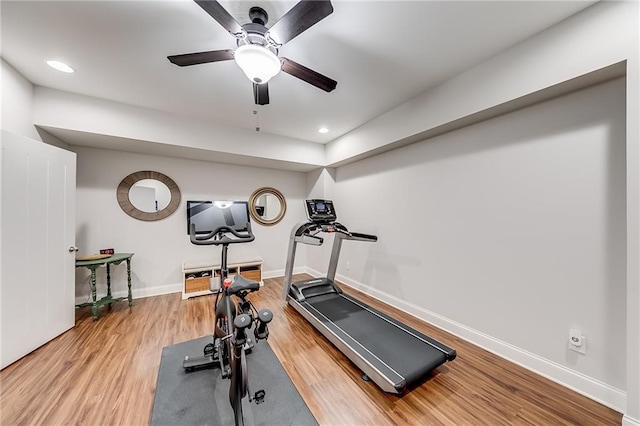 exercise room featuring wood finished floors, baseboards, ceiling fan, and recessed lighting