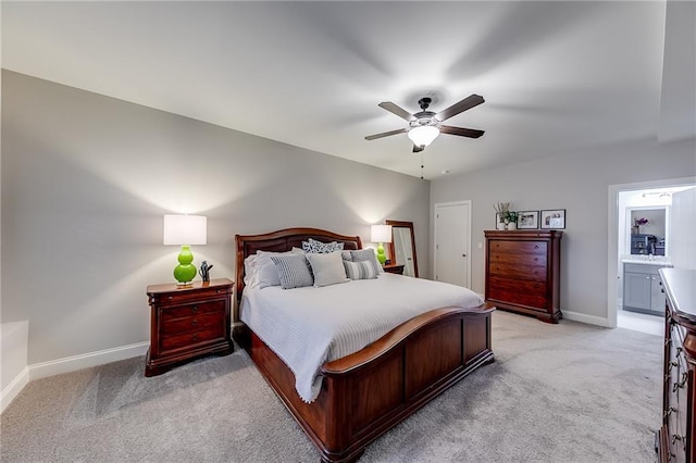 bedroom with light colored carpet, baseboards, and ceiling fan