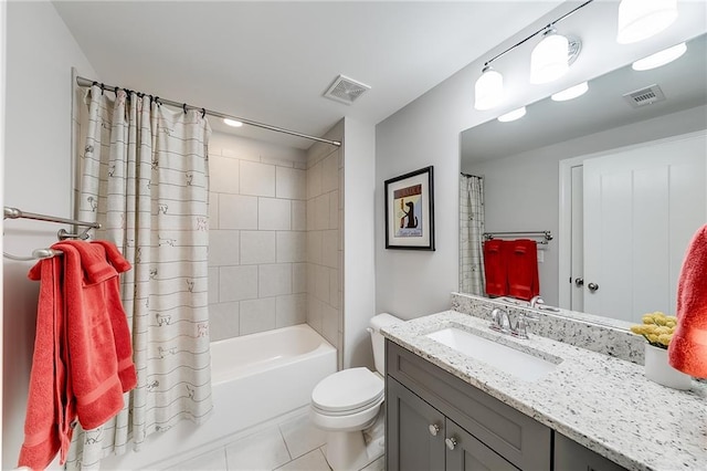 bathroom featuring tile patterned floors, toilet, vanity, and shower / tub combo