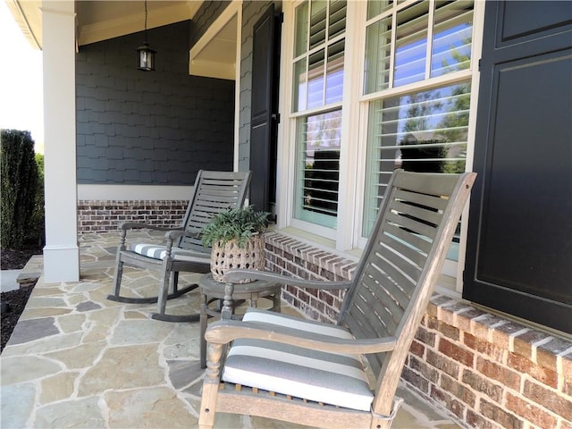 view of patio featuring a porch