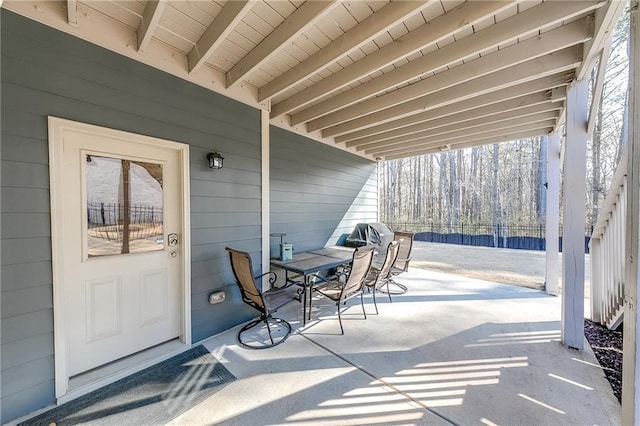 view of patio / terrace featuring fence and outdoor dining area