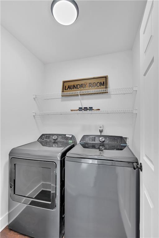 laundry room with washing machine and clothes dryer