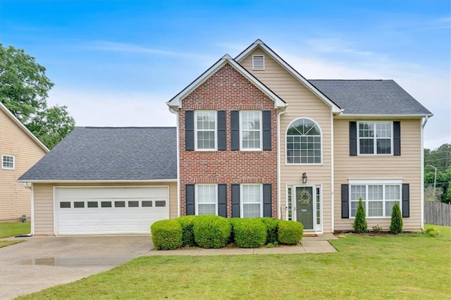 colonial inspired home featuring driveway, a garage, and a front lawn