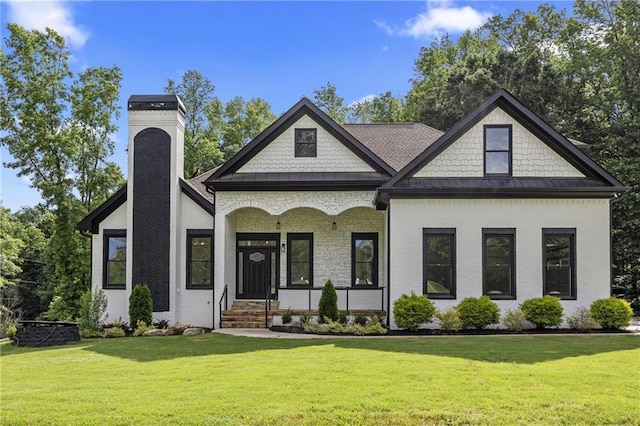 1217 Cabin Bridge Rd, Bethlehem, GA 30620 - view of front of property with brick siding, a front yard, and covered porch