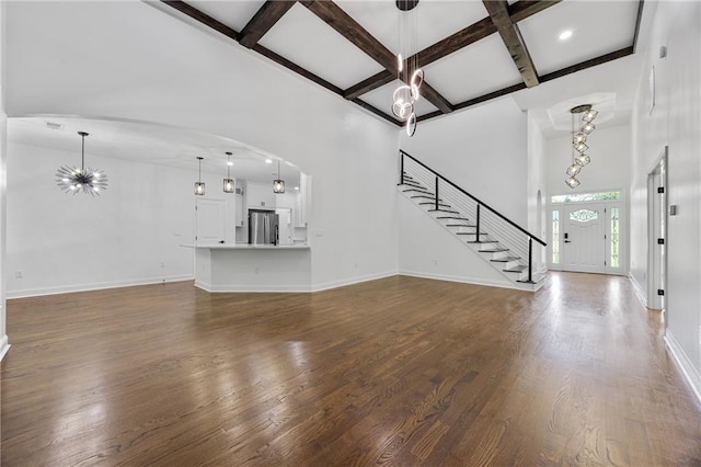 1217 Cabin Bridge Rd, Bethlehem, GA 30620 - unfurnished living room with coffered ceiling, stairs, beamed ceiling, baseboards, and dark wood-type flooring
