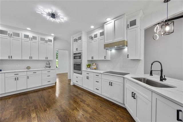 1217 Cabin Bridge Rd, Bethlehem, GA 30620 - kitchen with a sink, black electric cooktop, white cabinetry, double oven, and decorative backsplash