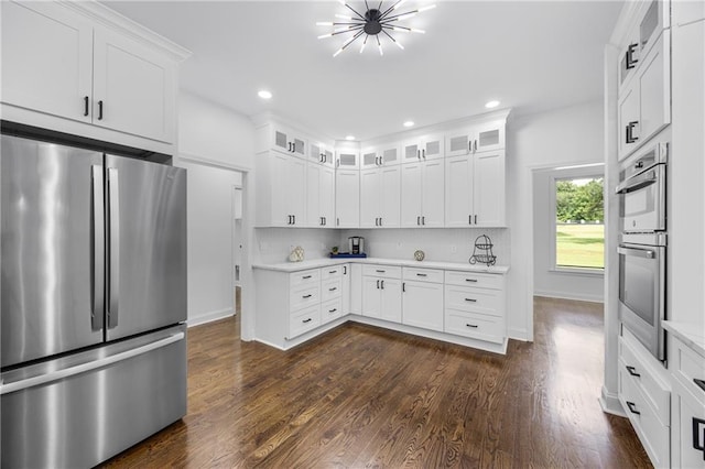 1217 Cabin Bridge Rd, Bethlehem, GA 30620 - kitchen with stainless steel appliances, light countertops, dark wood finished floors, glass insert cabinets, and recessed lighting