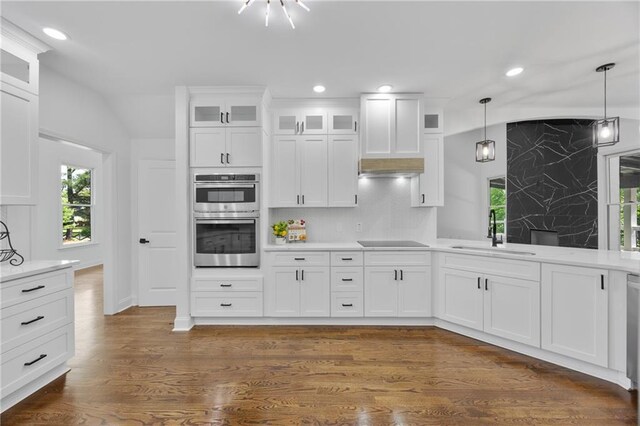1217 Cabin Bridge Rd, Bethlehem, GA 30620 - kitchen with a sink, double oven, black electric stovetop, healthy amount of natural light, and lofted ceiling
