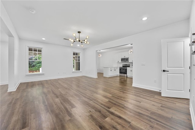 1217 Cabin Bridge Rd, Bethlehem, GA 30620 - unfurnished living room featuring a chandelier, dark wood-style floors, recessed lighting, and baseboards