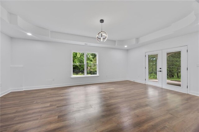 1217 Cabin Bridge Rd, Bethlehem, GA 30620 - empty room featuring a raised ceiling, wood finished floors, french doors, recessed lighting, and baseboards