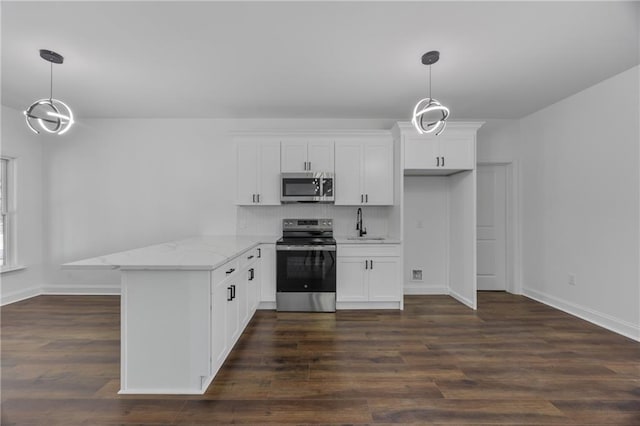 1217 Cabin Bridge Rd, Bethlehem, GA 30620 - kitchen featuring appliances with stainless steel finishes, a peninsula, white cabinetry, a sink, and tasteful backsplash
