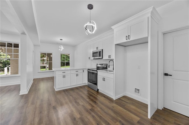 1217 Cabin Bridge Rd, Bethlehem, GA 30620 - kitchen with stainless steel appliances, a peninsula, white cabinets, and baseboards