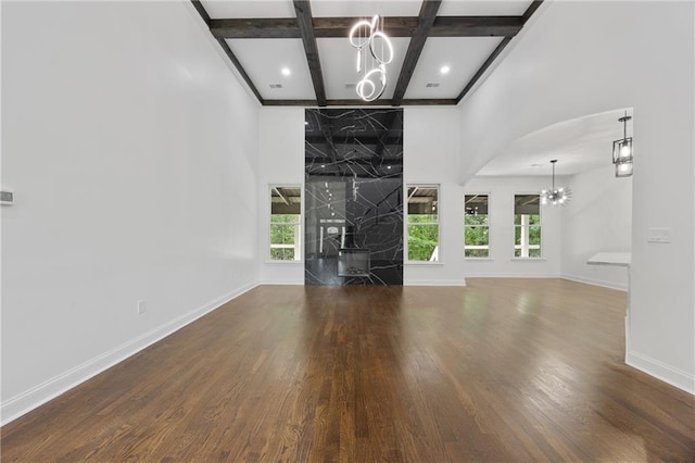1217 Cabin Bridge Rd, Bethlehem, GA 30620 - unfurnished living room featuring a chandelier, coffered ceiling, a high end fireplace, a towering ceiling, and baseboards