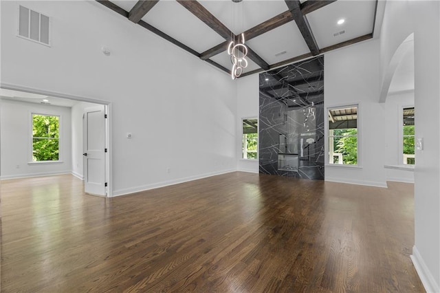 1217 Cabin Bridge Rd, Bethlehem, GA 30620 - unfurnished living room with a towering ceiling, coffered ceiling, wood finished floors, plenty of natural light, and beam ceiling