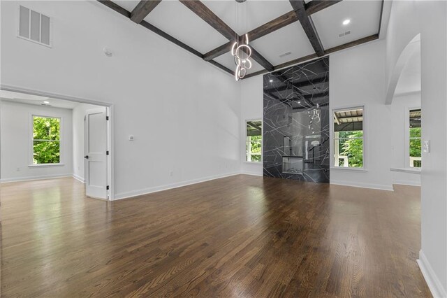 1217 Cabin Bridge Rd, Bethlehem, GA 30620 - unfurnished living room featuring a high ceiling, coffered ceiling, wood finished floors, healthy amount of natural light, and baseboards