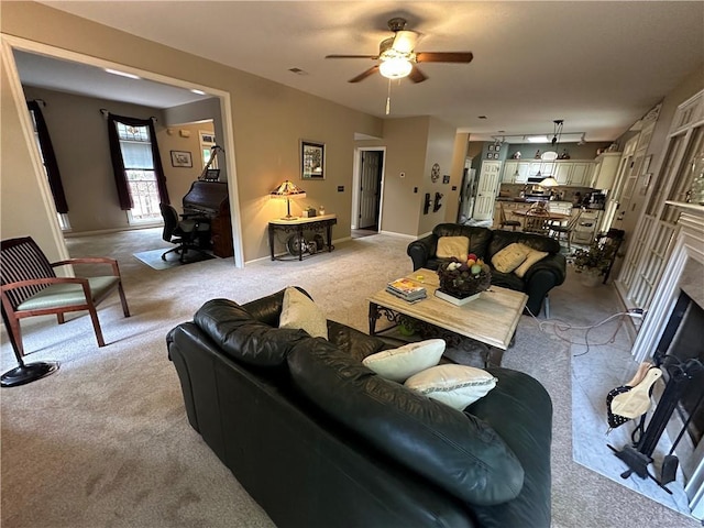 3962 Fox Glen Dr, Woodstock, GA 30189 - living area featuring light carpet, ceiling fan, and a fireplace
