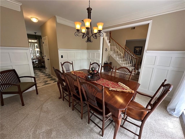 3962 Fox Glen Dr, Woodstock, GA 30189 - dining area with a decorative wall, a chandelier, crown molding, stairway, and light colored carpet