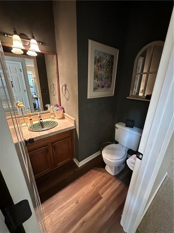 3962 Fox Glen Dr, Woodstock, GA 30189 - bathroom featuring wood finished floors and vanity