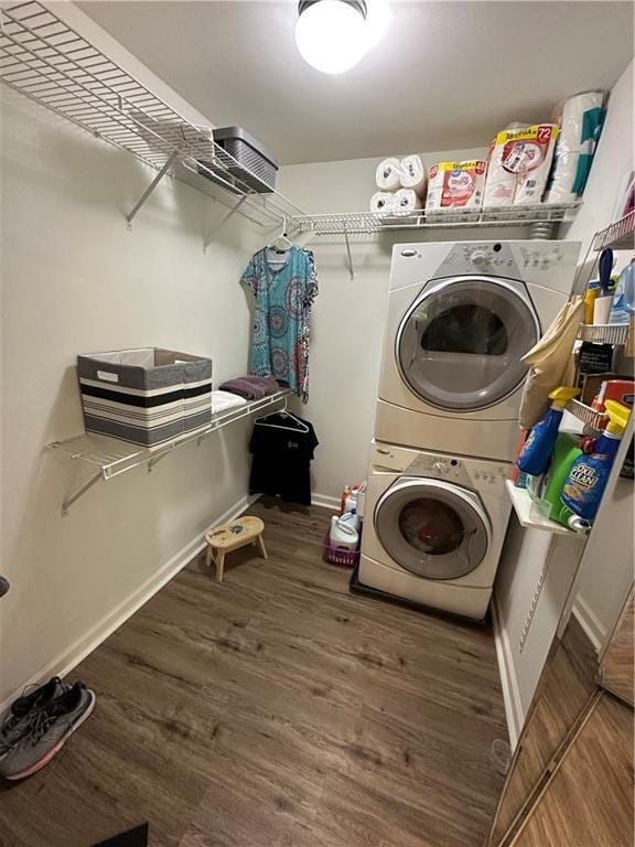 3962 Fox Glen Dr, Woodstock, GA 30189 - laundry area with estacked washer and dryer and wood finished floors