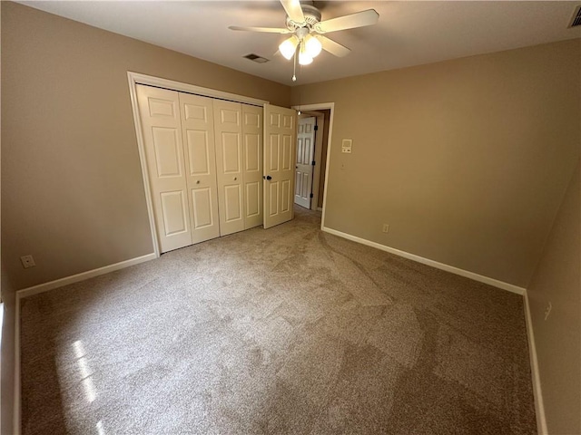 3962 Fox Glen Dr, Woodstock, GA 30189 - unfurnished bedroom with a closet, a ceiling fan, and carpet floors