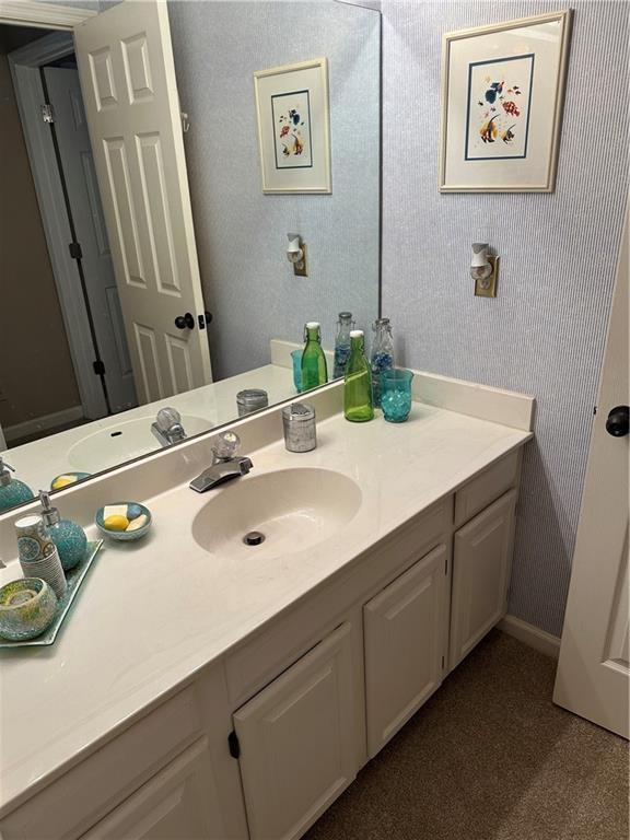 3962 Fox Glen Dr, Woodstock, GA 30189 - bathroom with vanity and wallpapered walls