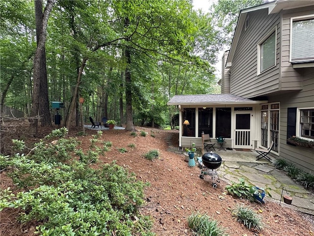 3962 Fox Glen Dr, Woodstock, GA 30189 - view of yard featuring a sunroom and a patio area