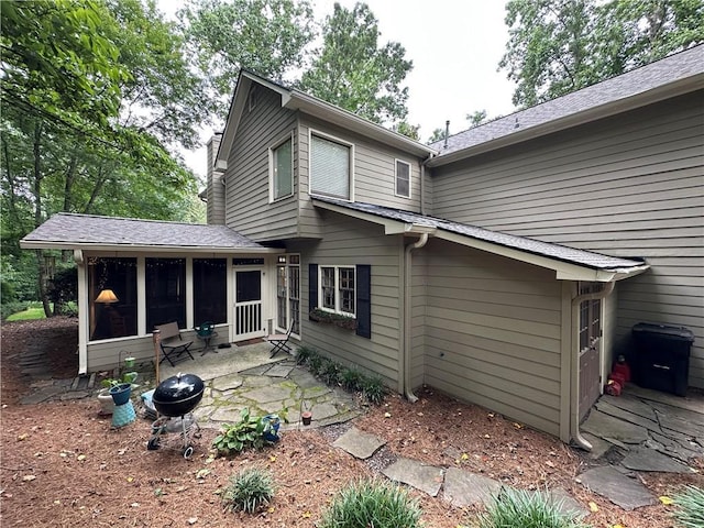3962 Fox Glen Dr, Woodstock, GA 30189 - back of property featuring a sunroom and a patio area