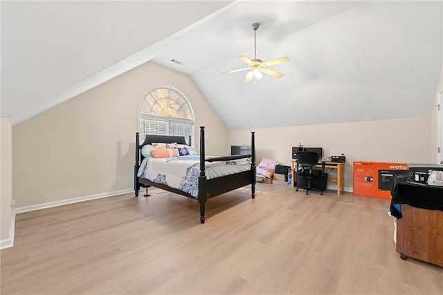 bedroom featuring light wood-type flooring, vaulted ceiling, and ceiling fan